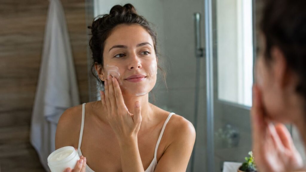 Applying broad-spectrum sunscreen as the final morning skincare step