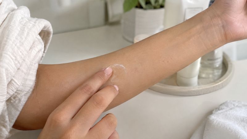 patch testing a new skincare product before applying it to the face