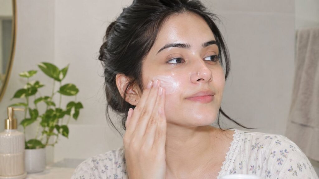 Woman applying moisturizer for oily dehydrated skin on a shiny forehead and cheeks